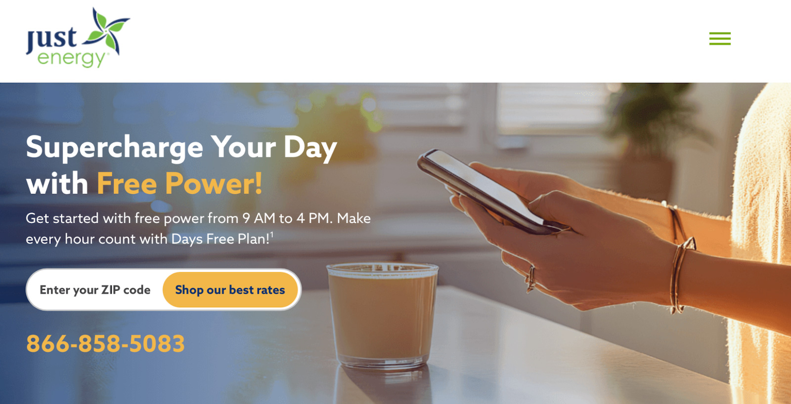 A person holding a smartphone next to a cup of coffee in a bright home environment, representing convenient energy management on mobile devices.